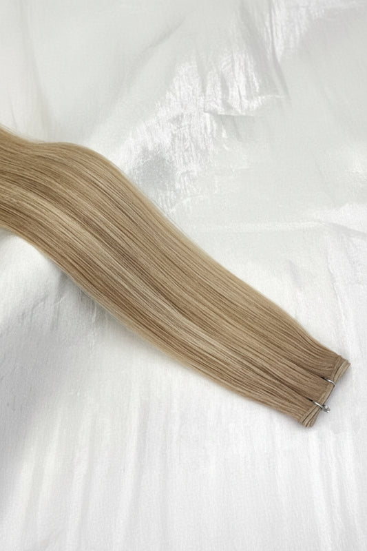 Rooted bright beige/blonde highlights